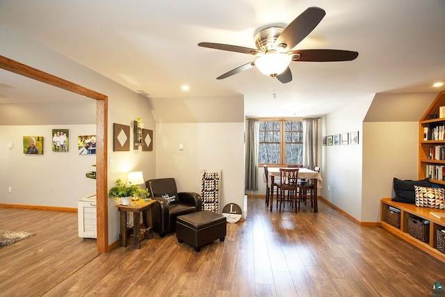 sitting room featuring baseboards, a ceiling fan, recessed lighting, and wood finished floors