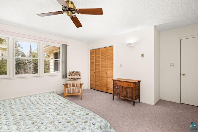 bedroom featuring carpet floors, a ceiling fan, and a closet