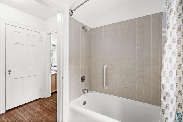 bathroom featuring shower / bath combo with shower curtain and wood finished floors