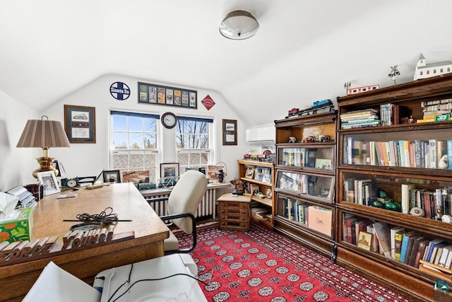 home office featuring lofted ceiling