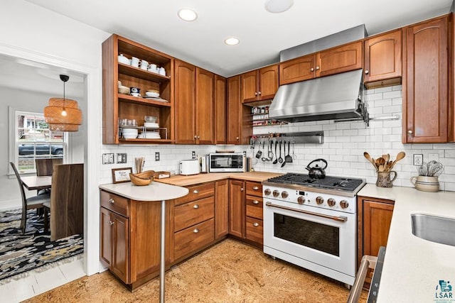 kitchen with under cabinet range hood, open shelves, white range with gas stovetop, and light countertops