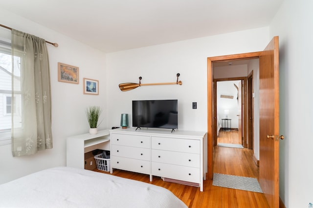 bedroom with light wood-style floors