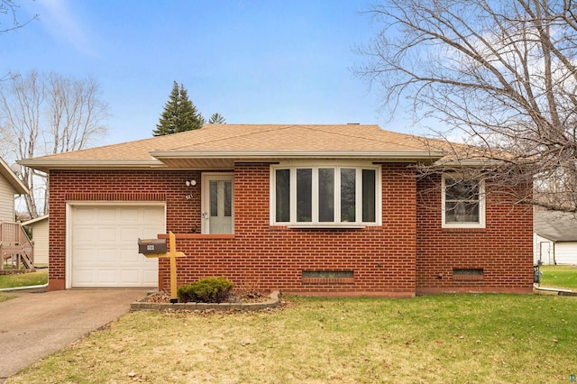 single story home with brick siding, a garage, driveway, and a front yard