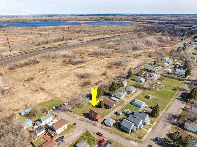 bird's eye view with a water view and a residential view