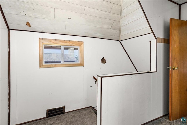 interior space featuring visible vents and carpet floors