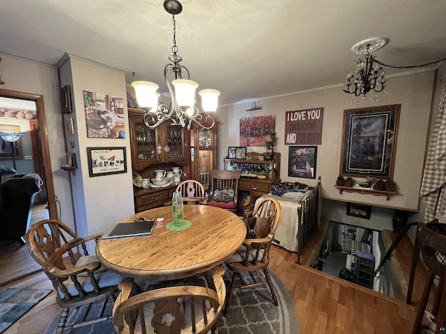22 Hays Crk, Silver Bay, MN 55614 - dining space with a chandelier, ornamental molding, and wood finished floors