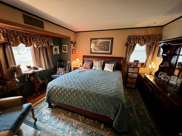 22 Hays Crk, Silver Bay, MN 55614 - bedroom with crown molding, dark wood-style flooring, and visible vents
