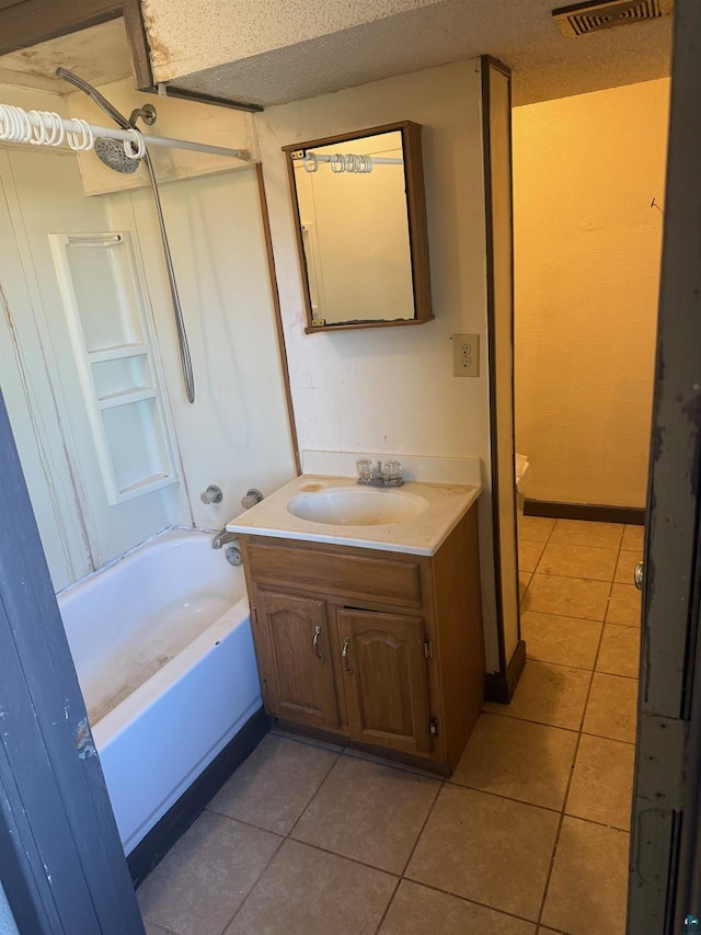 bathroom with shower / bath combination, tile patterned floors, vanity, and visible vents