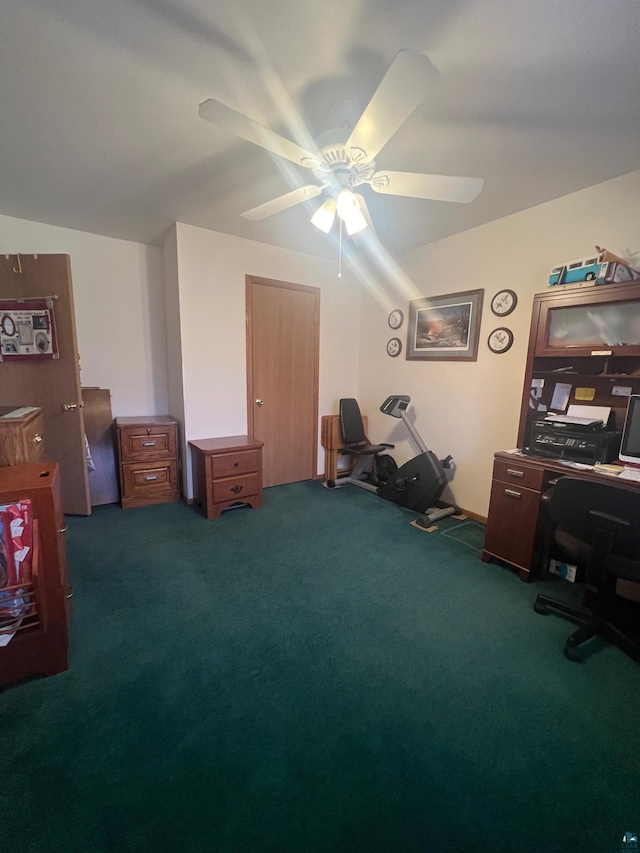 home office with a ceiling fan and carpet floors