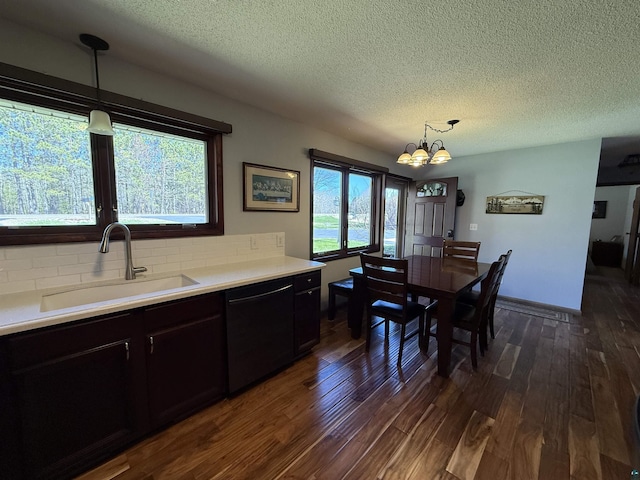 46040 State Highway 65, Nashwauk, MN 55769 - dining room featuring dark wood-style flooring, an inviting chandelier, and a textured ceiling