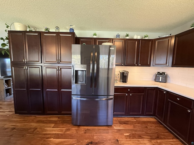 46040 State Highway 65, Nashwauk, MN 55769 - kitchen with a textured ceiling, dark wood-style flooring, light countertops, and stainless steel refrigerator with ice dispenser