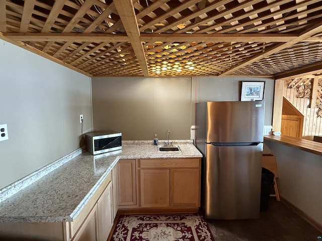 46040 State Highway 65, Nashwauk, MN 55769 - kitchen with light stone countertops, appliances with stainless steel finishes, and a sink