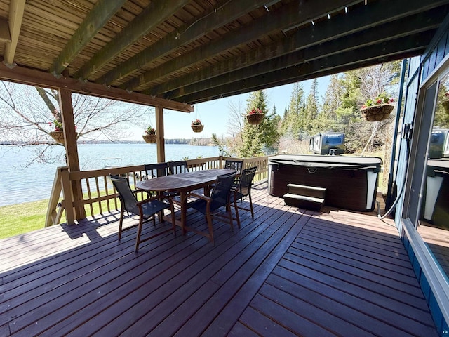 46040 State Highway 65, Nashwauk, MN 55769 - wooden deck with a hot tub, a water view, and outdoor dining space