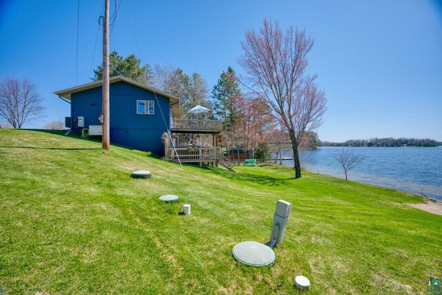 46040 State Highway 65, Nashwauk, MN 55769 - view of yard featuring a deck with water view and stairway
