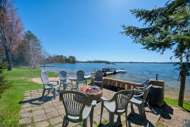 46040 State Highway 65, Nashwauk, MN 55769 - view of patio / terrace with an outdoor fire pit, a water view, and a dock