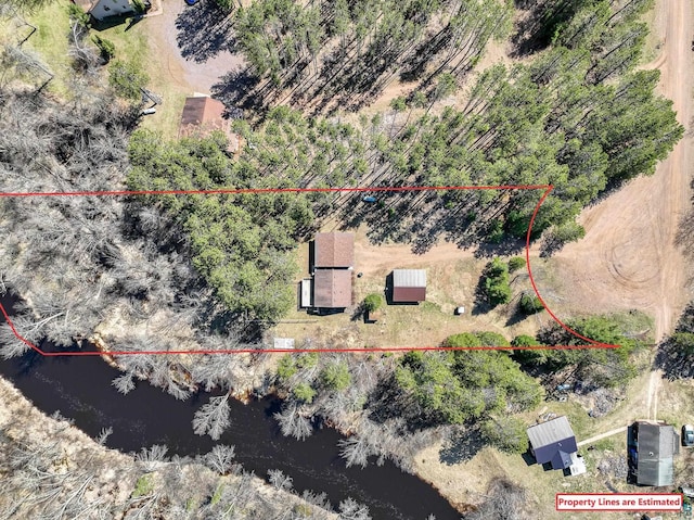 drone / aerial view featuring a water view and a rural view