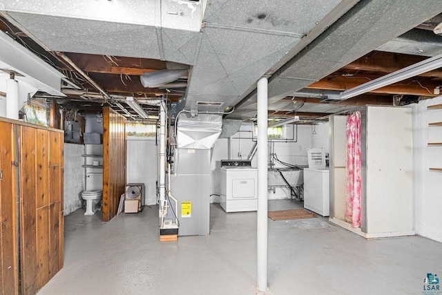 basement with washer / dryer and electric panel