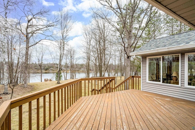 wooden deck featuring a water view