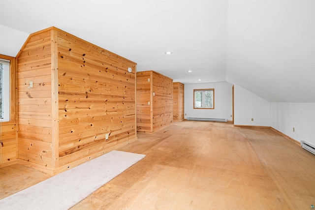 bonus room with lofted ceiling, baseboard heating, and recessed lighting