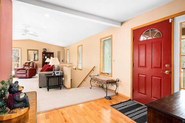 entrance foyer featuring recessed lighting, lofted ceiling with beams, a ceiling fan, and wood finished floors