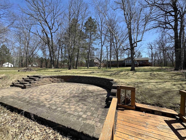 exterior space with a patio and a lawn