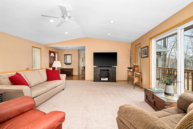 living area featuring lofted ceiling, light colored carpet, recessed lighting, a ceiling fan, and baseboards