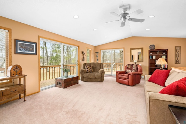 carpeted living room with lofted ceiling, ceiling fan, and recessed lighting