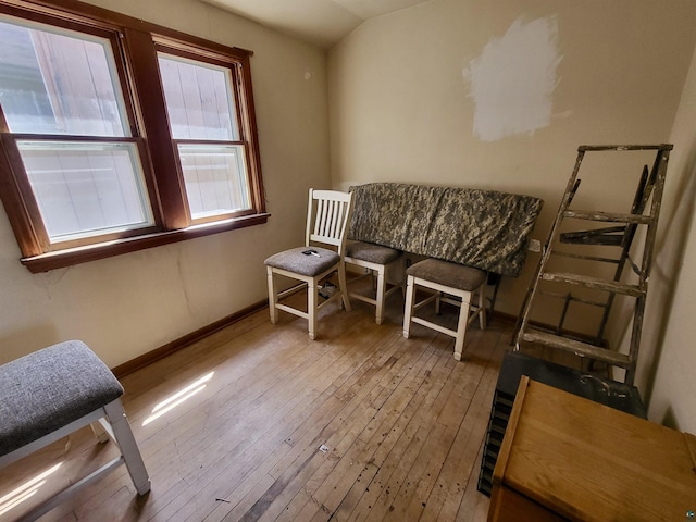 sitting room featuring baseboards and hardwood / wood-style floors