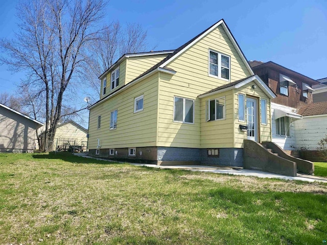 view of home's exterior featuring a lawn