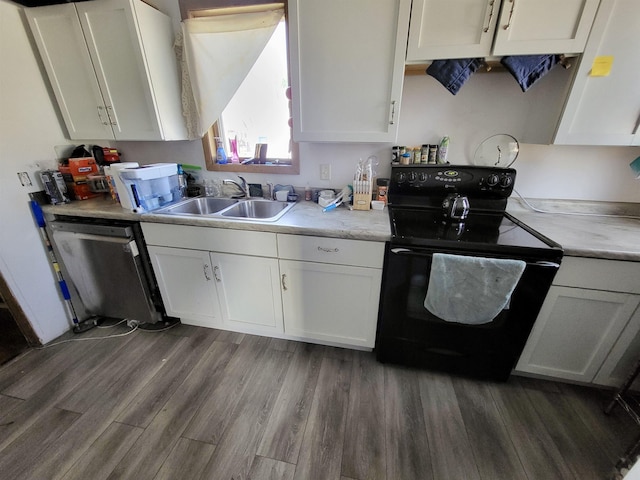 kitchen with a sink, dishwasher, black electric range, dark wood-style flooring, and white cabinetry