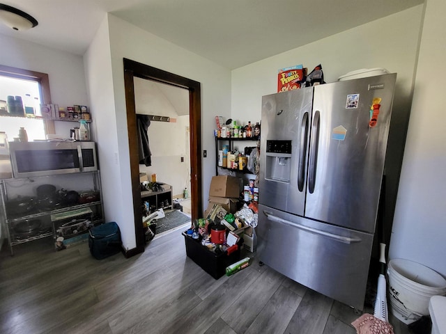 kitchen featuring dark wood finished floors and appliances with stainless steel finishes