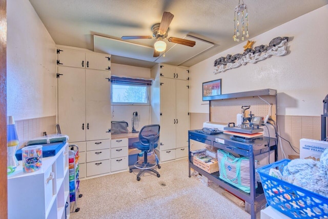 interior space with ceiling fan and light carpet