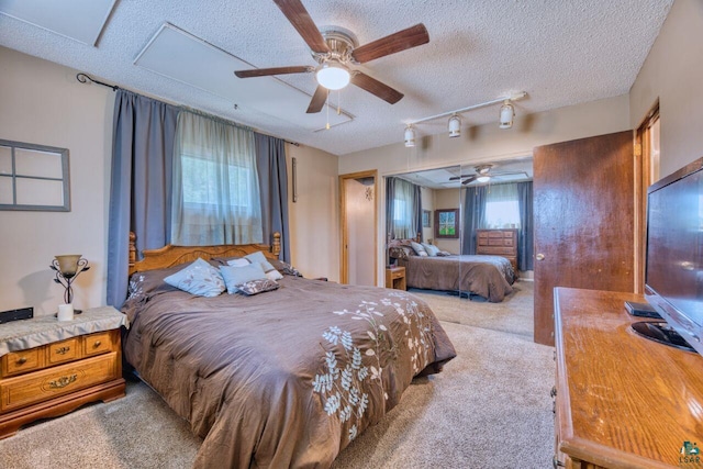 carpeted bedroom featuring a textured ceiling