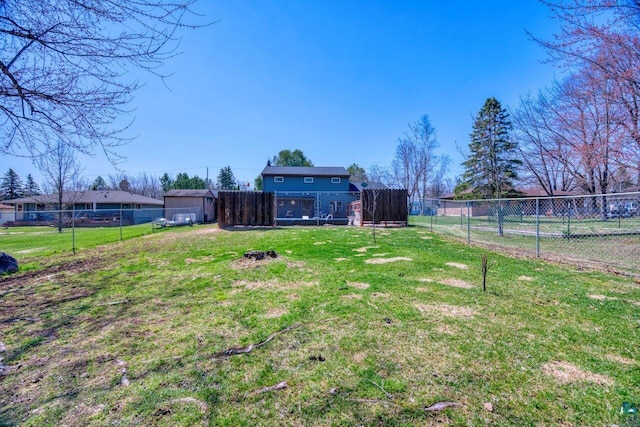view of yard with a fenced backyard