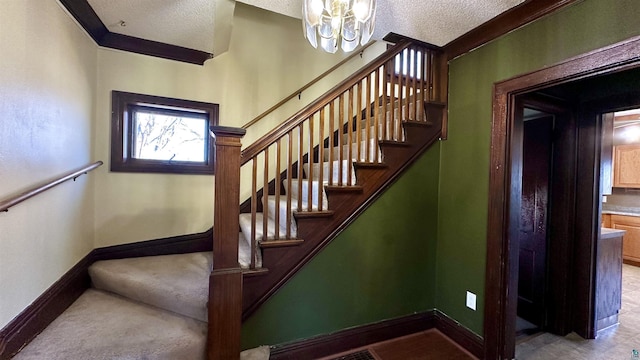 stairway featuring a textured ceiling, a chandelier, and baseboards