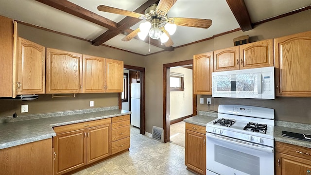 kitchen featuring white appliances, ceiling fan, beam ceiling, light floors, and baseboards