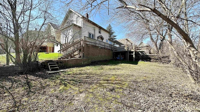 view of yard with stairway and a wooden deck