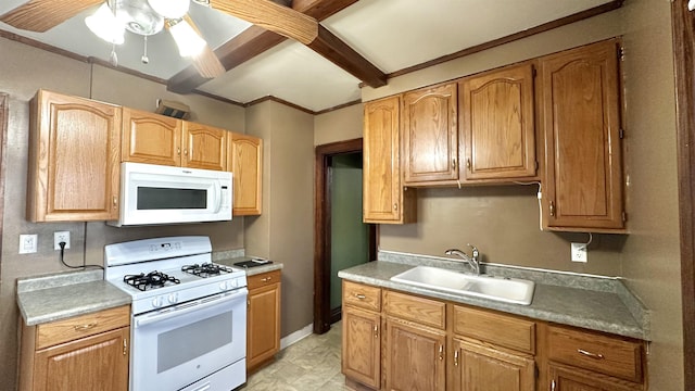kitchen with white appliances, a sink, a ceiling fan, beamed ceiling, and light countertops