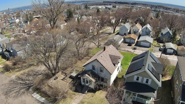 aerial view of property and surrounding area featuring nearby suburban area and a notable bridge