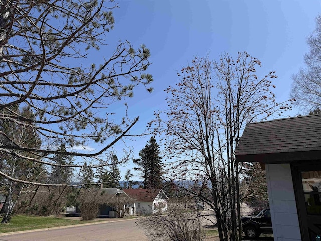 15 W 8th Ave, Grand Marais, MN 55604 - view of side of home featuring a shingled roof