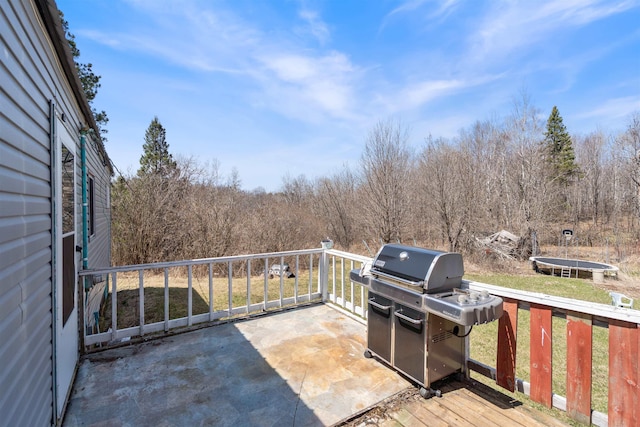 5463 Maple Hill Rd, Proctor, MN 55810 - wooden terrace with grilling area and a wooded view