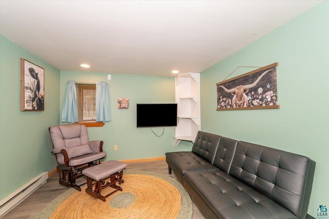 1514 14th St, Cloquet, MN 55720 - living room featuring a baseboard radiator, wood finished floors, recessed lighting, and baseboards