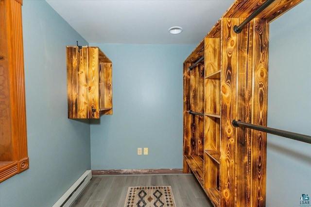 1514 14th St, Cloquet, MN 55720 - spacious closet featuring wood finished floors and a baseboard heating unit