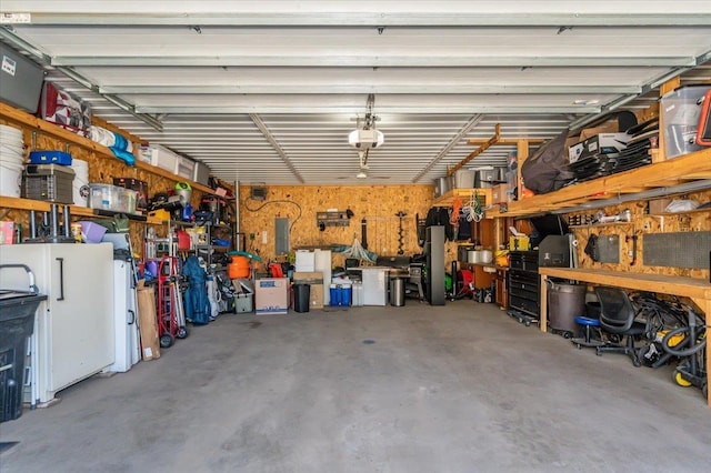 1514 14th St, Cloquet, MN 55720 - garage with a workshop area and a garage door opener