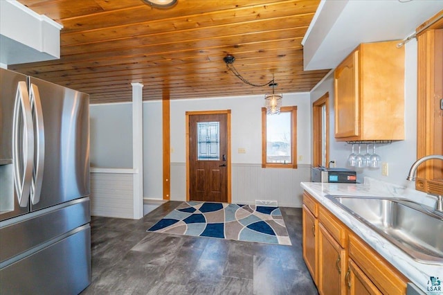 1514 14th St, Cloquet, MN 55720 - kitchen featuring freestanding refrigerator, a sink, wooden ceiling, wainscoting, and light countertops