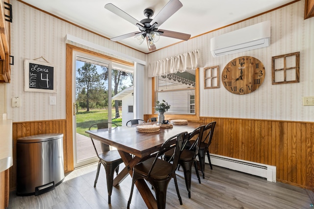 1741 Olsonville Crk, Carlton, MN 55718 - dining room featuring a baseboard radiator, a wall unit AC, a wainscoted wall, wood walls, and wallpapered walls