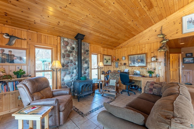 118 Sunset Rd, Ely, MN 55731 - tiled living room featuring a wood stove, wood walls, wooden ceiling, and high vaulted ceiling