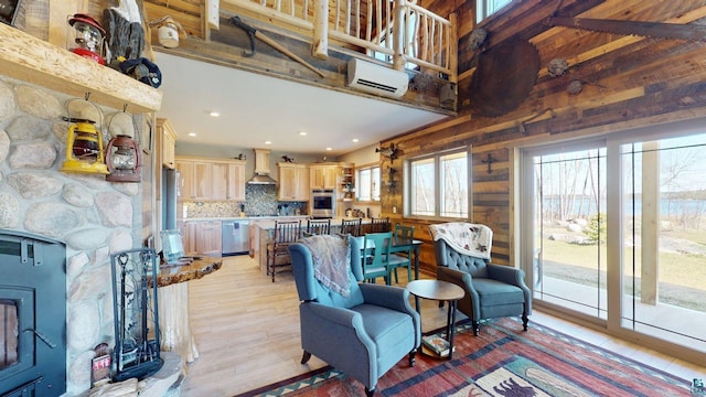 7498 Bayside Dr, Crane Lake, MN 55725 - living area featuring wooden walls, light wood-type flooring, and recessed lighting