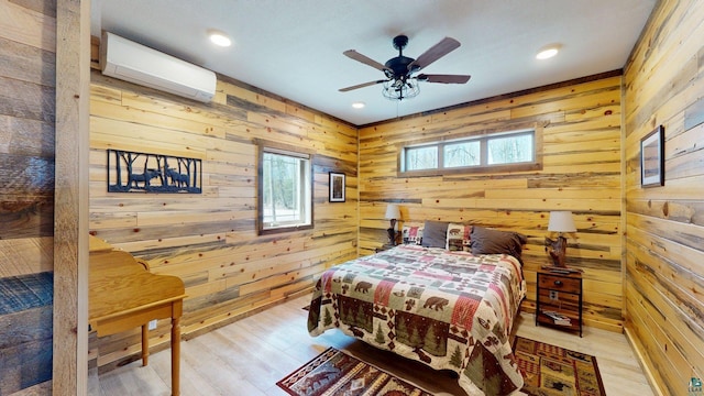 7498 Bayside Dr, Crane Lake, MN 55725 - bedroom with a wall unit AC, wooden walls, wood finished floors, and recessed lighting
