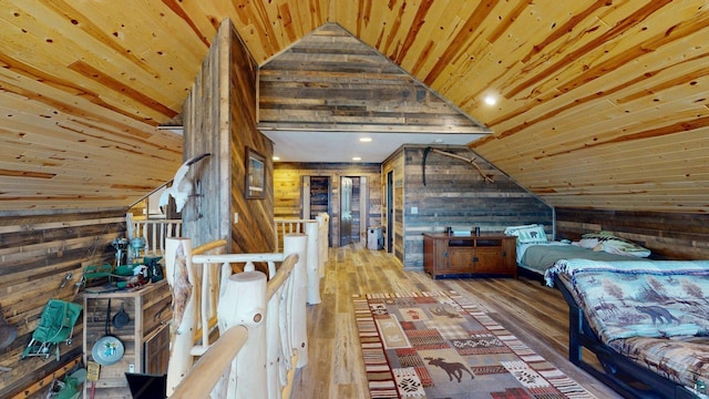 7498 Bayside Dr, Crane Lake, MN 55725 - bedroom with wooden walls, vaulted ceiling, wood finished floors, and wood ceiling